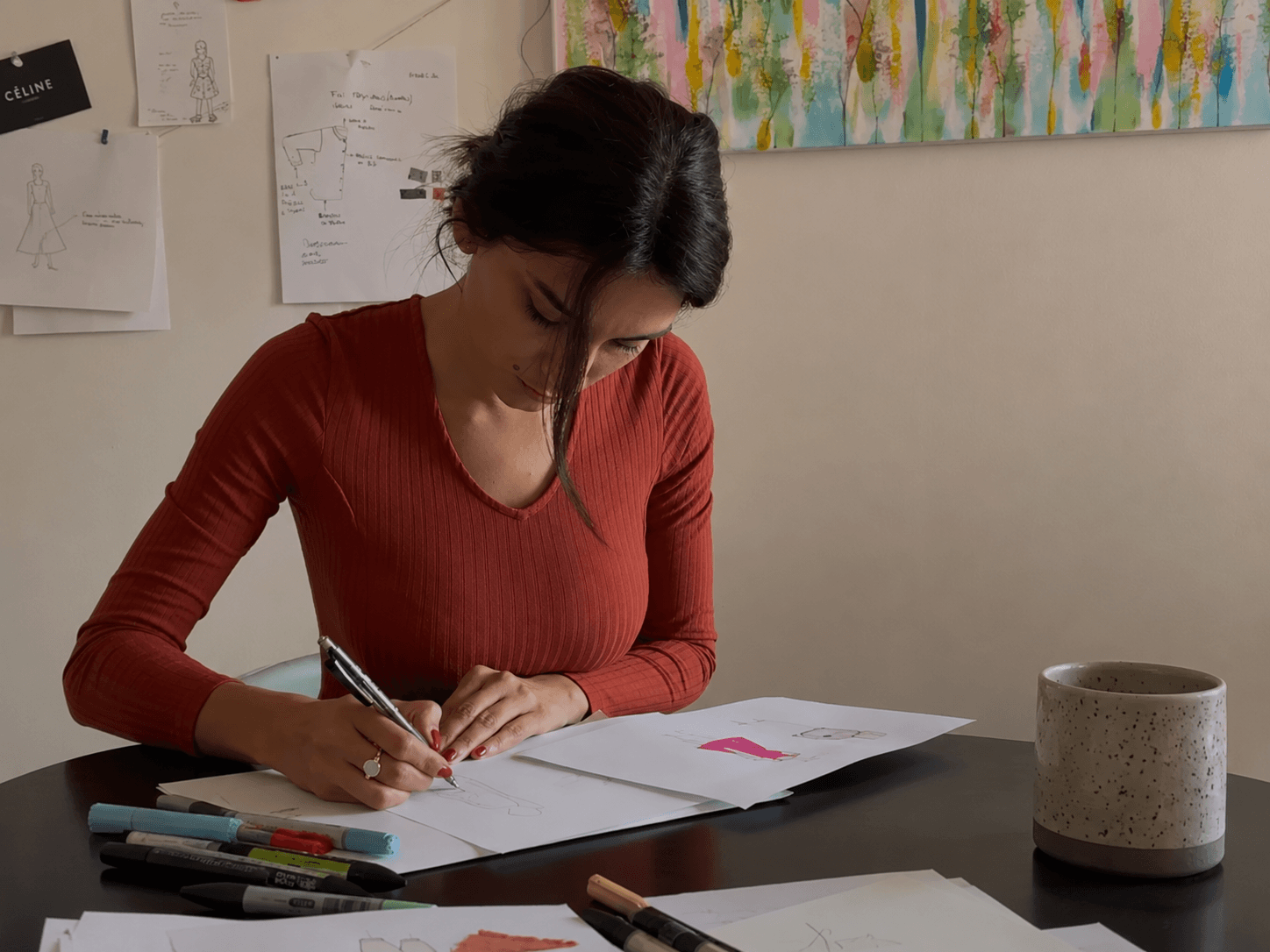 The founder of Farway Milano sketching a garment