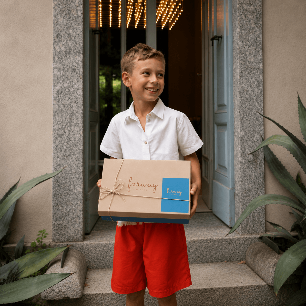 A Farway Milano boy holding a wrapped gift